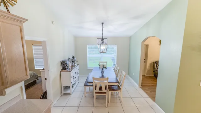 a dining room with furniture and window