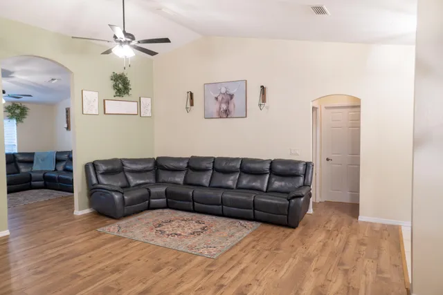 a view of a livingroom with furniture and a flat screen tv