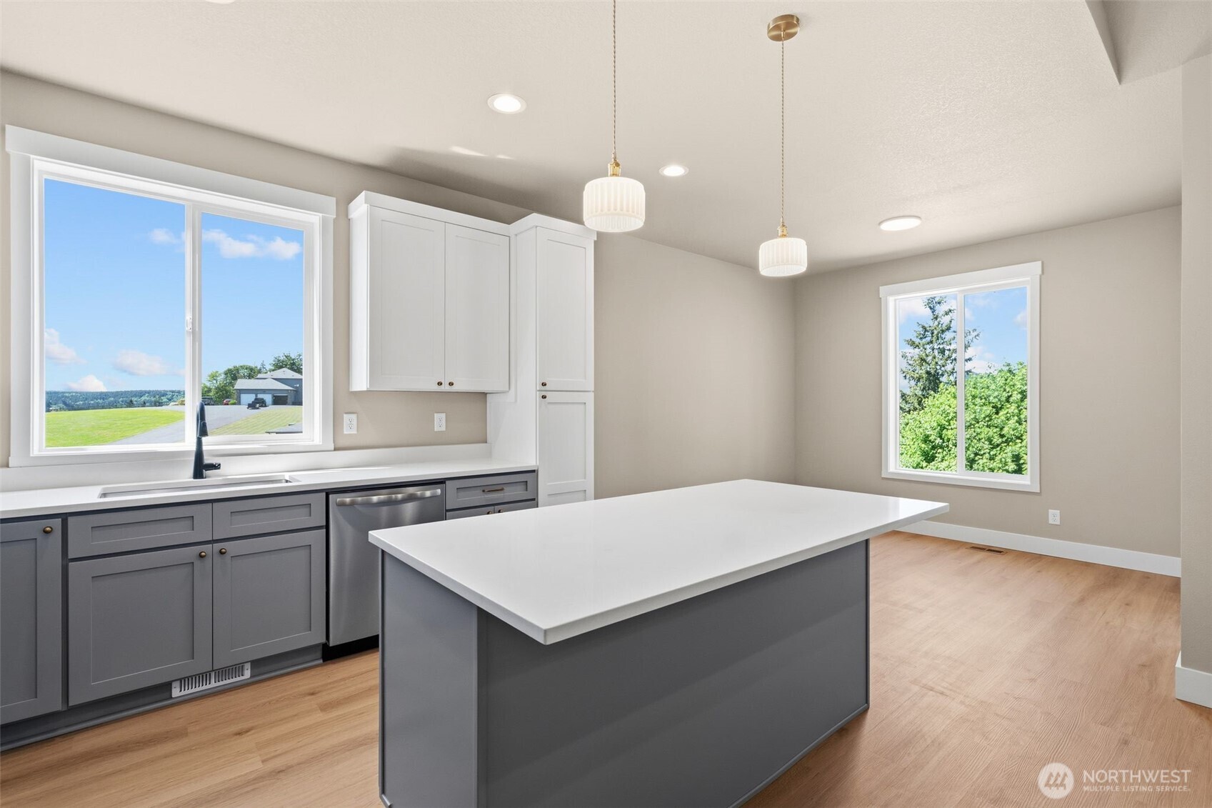 254 Windy Ridge Drive Longview, WA 98632 - Photo 13 of 27 a kitchen with a sink a window and cabinets