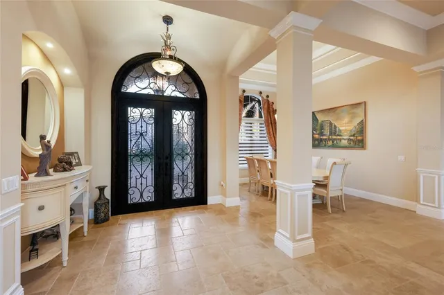 a living room with furniture and a ceiling fan