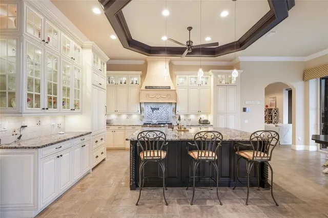 a bedroom with a large bed and a large window