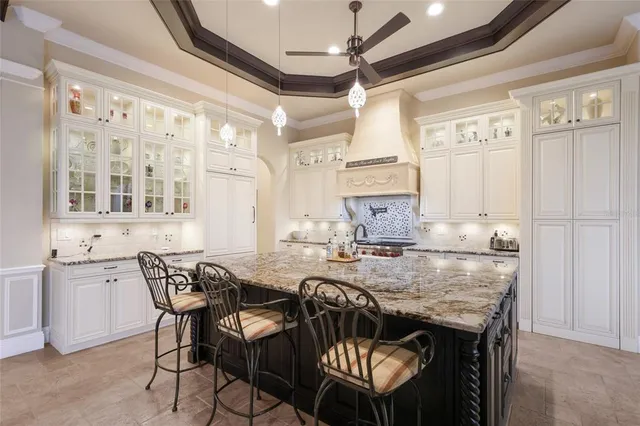 a bathroom with double vanity sinks a toilet a shower and a mirror
