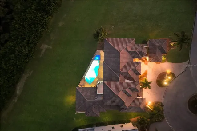 a front view of a house with a yard and outdoor seating