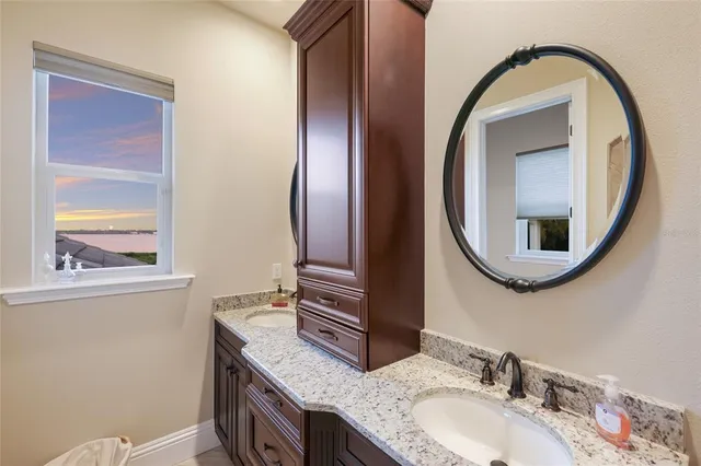 an aerial view of a house with a lake view