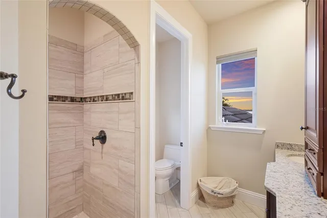 a view of a lake with lawn chairs