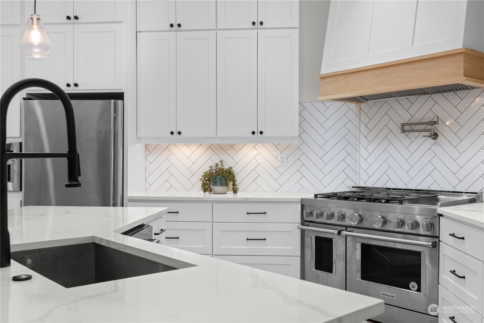 20919 29th Avenue Southeast Bothell, WA 98021 - Photo 13 of 32 a kitchen with granite countertop a sink stainless steel appliances and cabinets