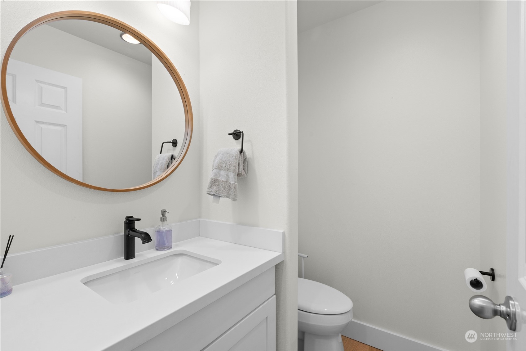20919 29th Avenue Southeast Bothell, WA 98021 - Photo 24 of 32 a bathroom with a sink a toilet and a mirror