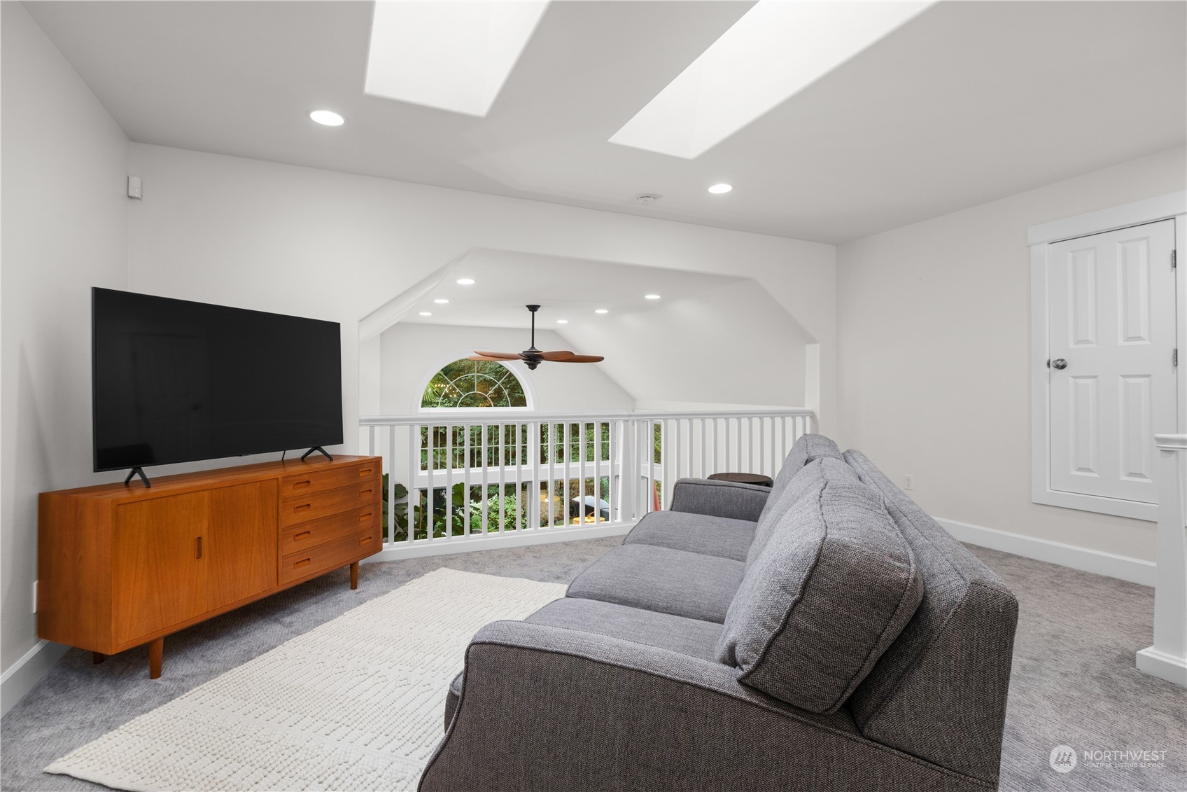 20919 29th Avenue Southeast Bothell, WA 98021 - Photo 31 of 32 a living room with furniture and a flat screen tv