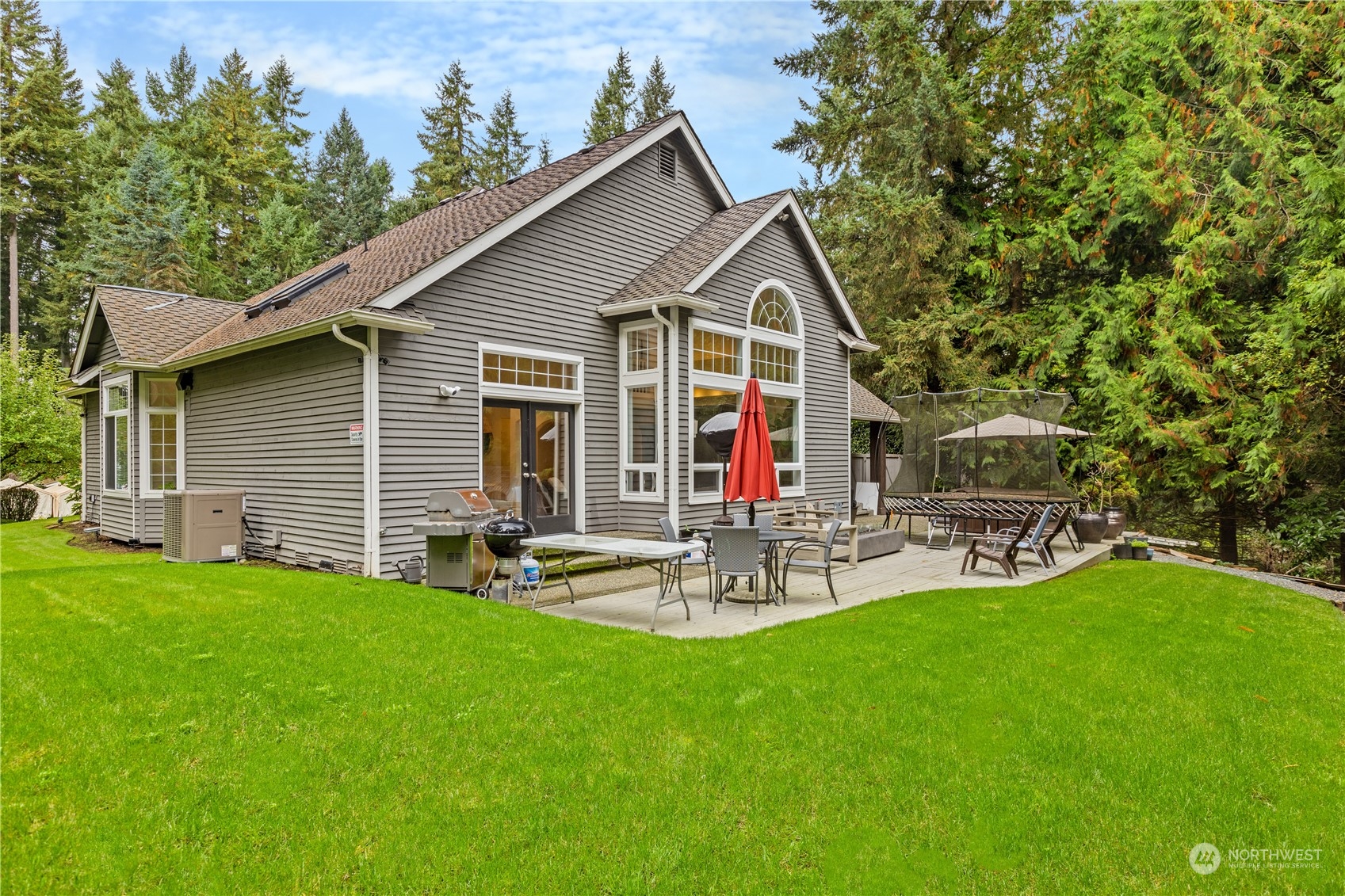 20919 29th Avenue Southeast Bothell, WA 98021 - Photo 32 of 32 a view of a chair and table in backyard of the house