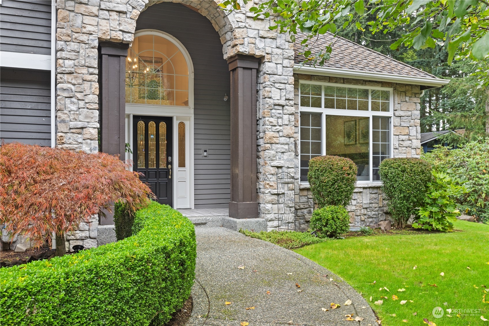 20919 29th Avenue Southeast Bothell, WA 98021 - Photo 4 of 32 a front view of a house with garden