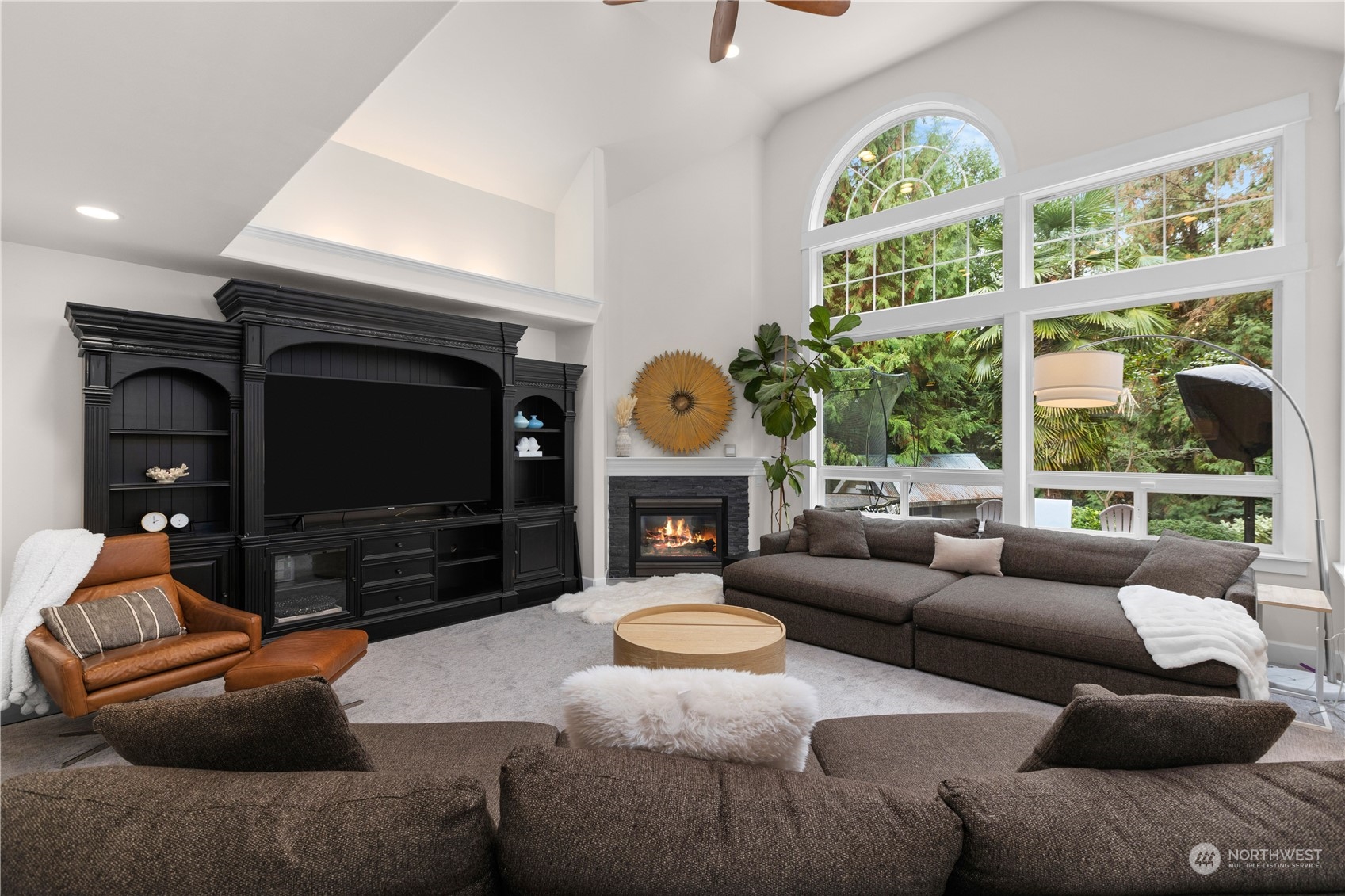 20919 29th Avenue Southeast Bothell, WA 98021 - Photo 10 of 32 a living room with furniture a window and a fireplace