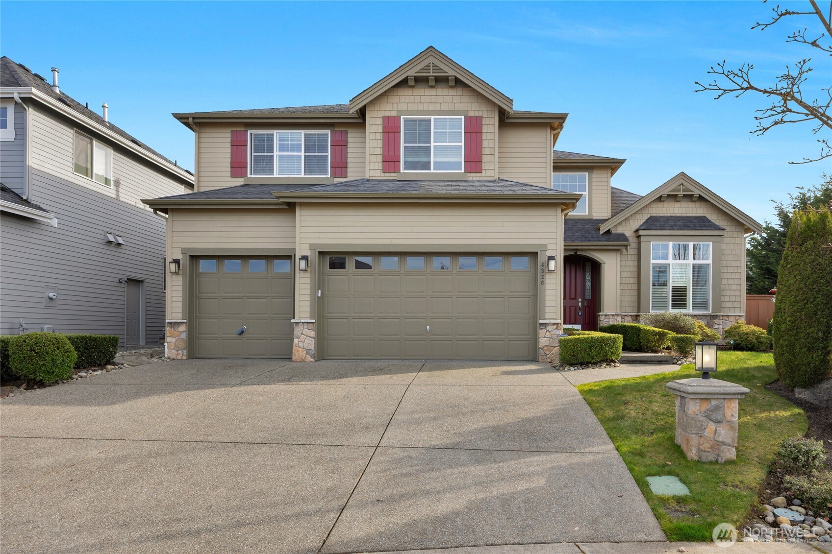 4326 221st Street Southeast Bothell, WA 98021 - Photo 1 of 34 a front view of a house with a yard and garage