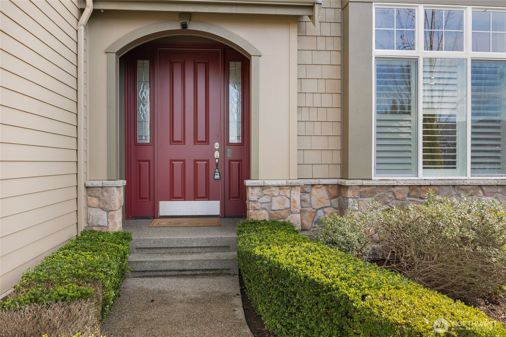 4326 221st Street Southeast Bothell, WA 98021 - Photo 2 of 34 a front view of a house with a garden