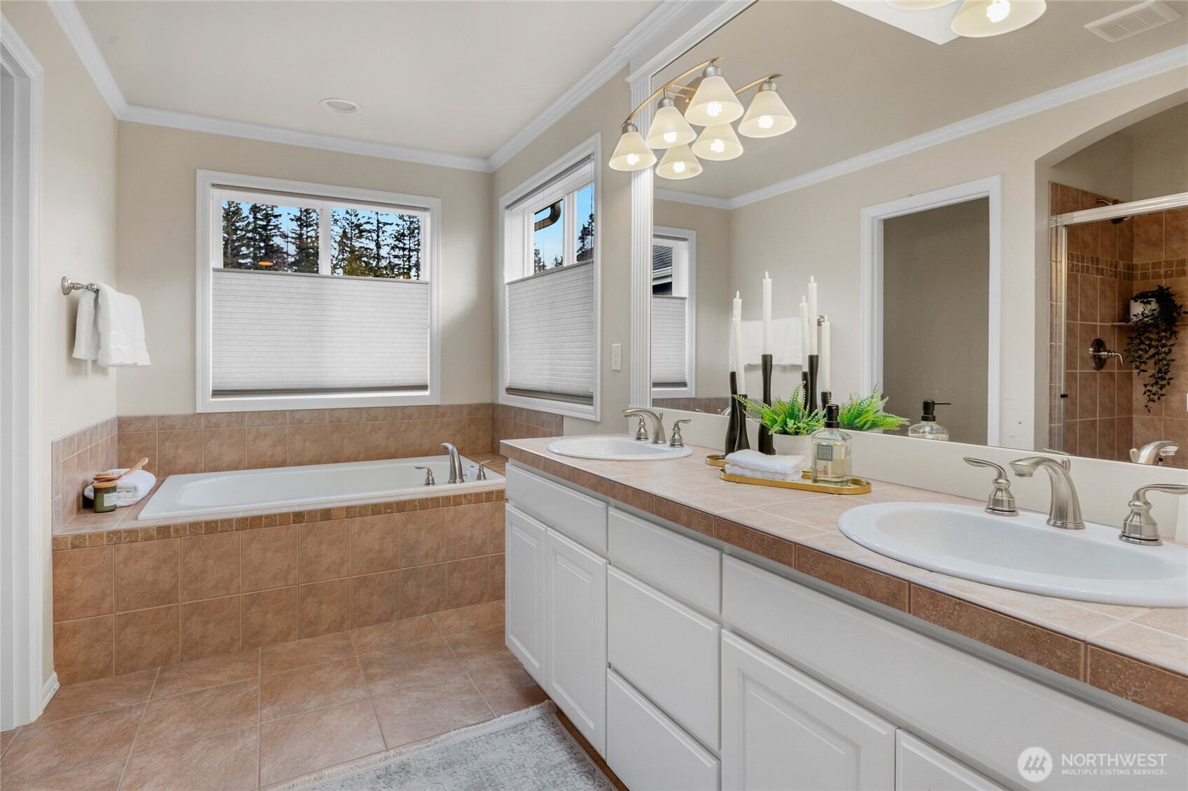 4326 221st Street Southeast Bothell, WA 98021 - Photo 26 of 34 a bathroom with a tub a sink and a mirror