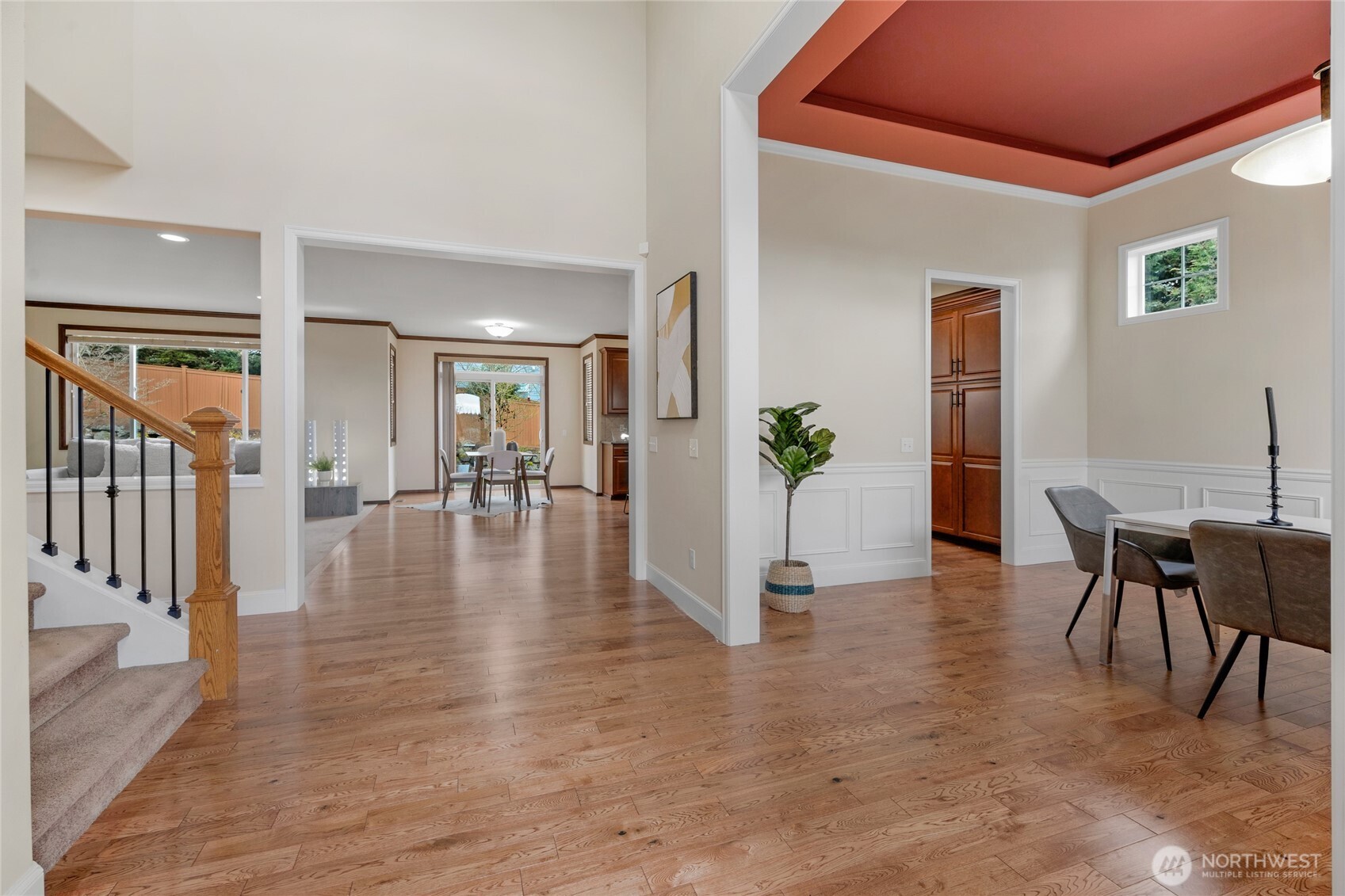 4326 221st Street Southeast Bothell, WA 98021 - Photo 3 of 34 a view of a dining room and livingroom with furniture wooden floor a chandelier