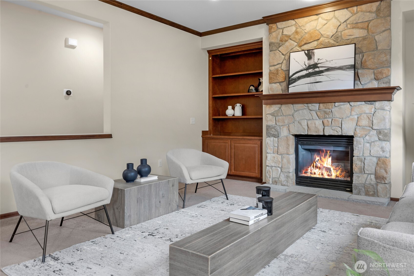 4326 221st Street Southeast Bothell, WA 98021 - Photo 8 of 34 a living room with furniture a rug and a fireplace
