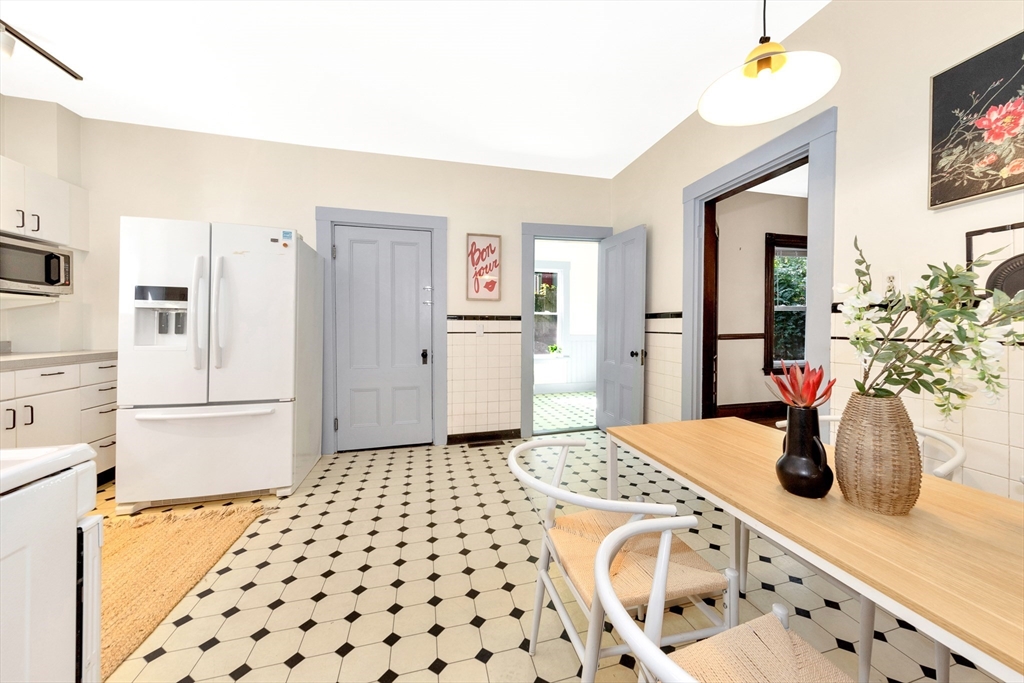 42 St Rose Street Boston, MA 02130 - Photo 14 of 41 a kitchen with a sink a refrigerator and cabinets