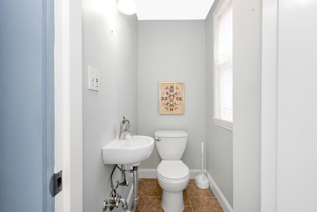 42 St Rose Street Boston, MA 02130 - Photo 17 of 41 a bathroom with a sink toilet and a mirror