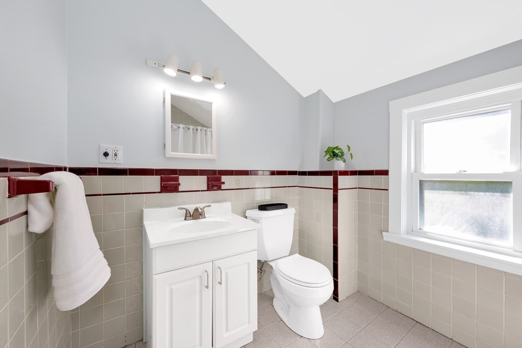 42 St Rose Street Boston, MA 02130 - Photo 24 of 41 a bathroom with a sink vanity mirror and toilet