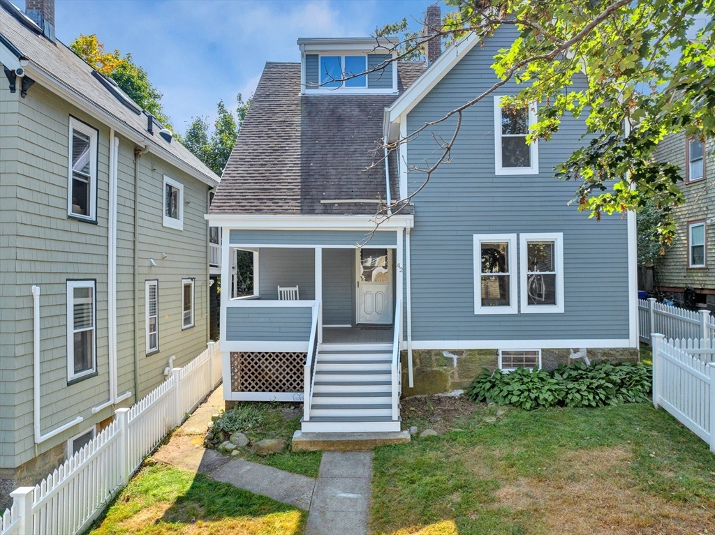 42 St Rose Street Boston, MA 02130 - Photo 33 of 41 a front view of a house with garden