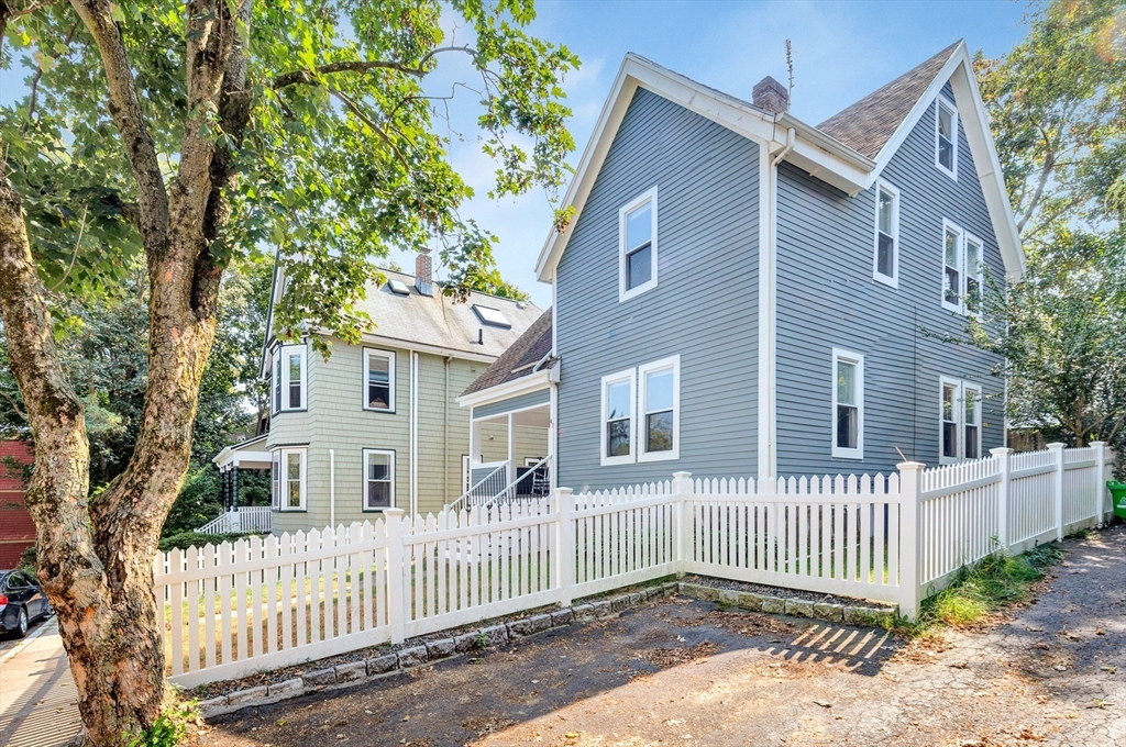 42 St Rose Street Boston, MA 02130 - Photo 34 of 41 a front view of a house with a porch