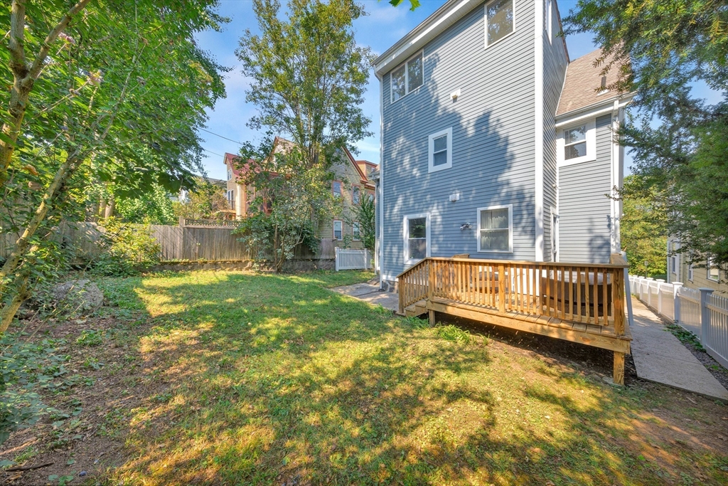 42 St Rose Street Boston, MA 02130 - Photo 37 of 41 a view of a house with a yard and deck