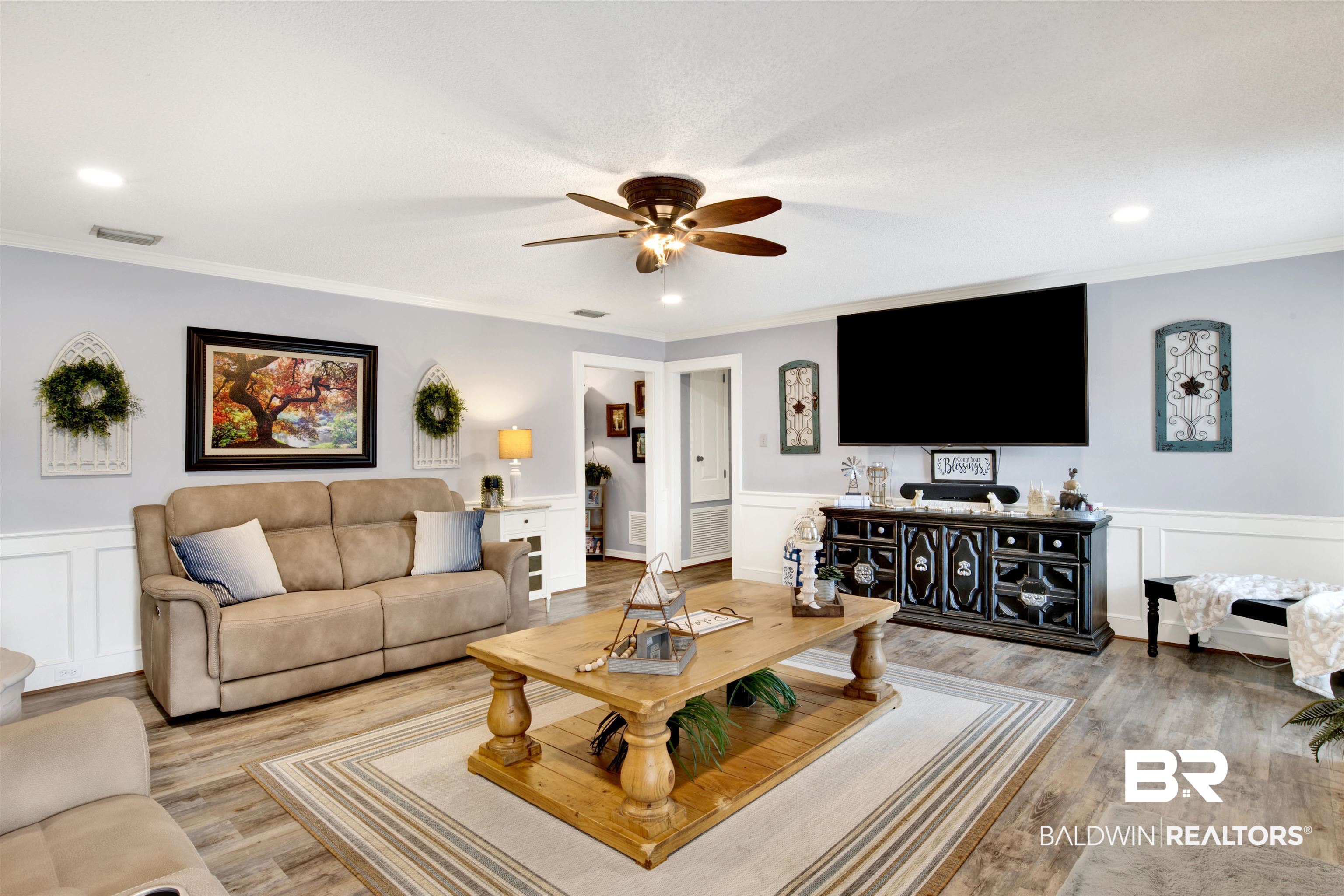 13385 Tom Gaston Road Mobile, AL 36695 - Photo 2 of 42 Living room featuring light wood-type flooring, ceiling fan, and crown molding