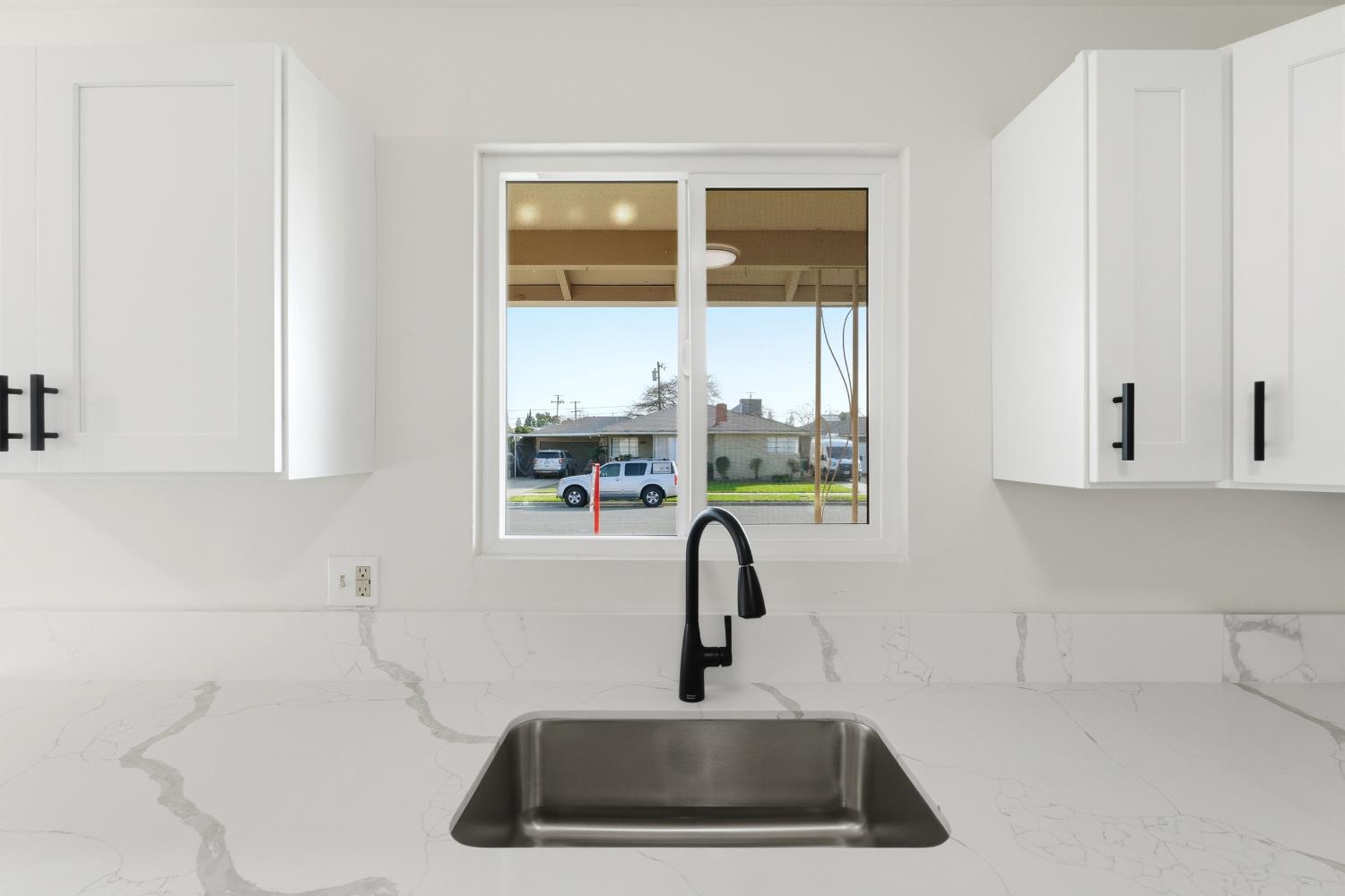 3473 East Dayton Avenue Fresno, CA 93726 - Photo 20 of 49 a bathroom with a sink and a window