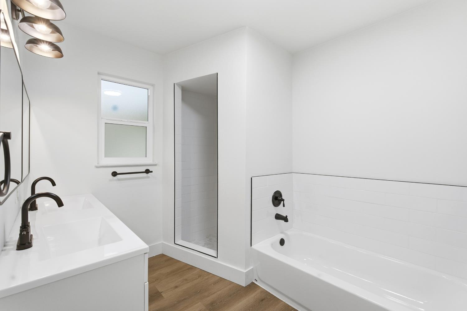 3473 East Dayton Avenue Fresno, CA 93726 - Photo 27 of 49 a bathroom with a bathtub and shower