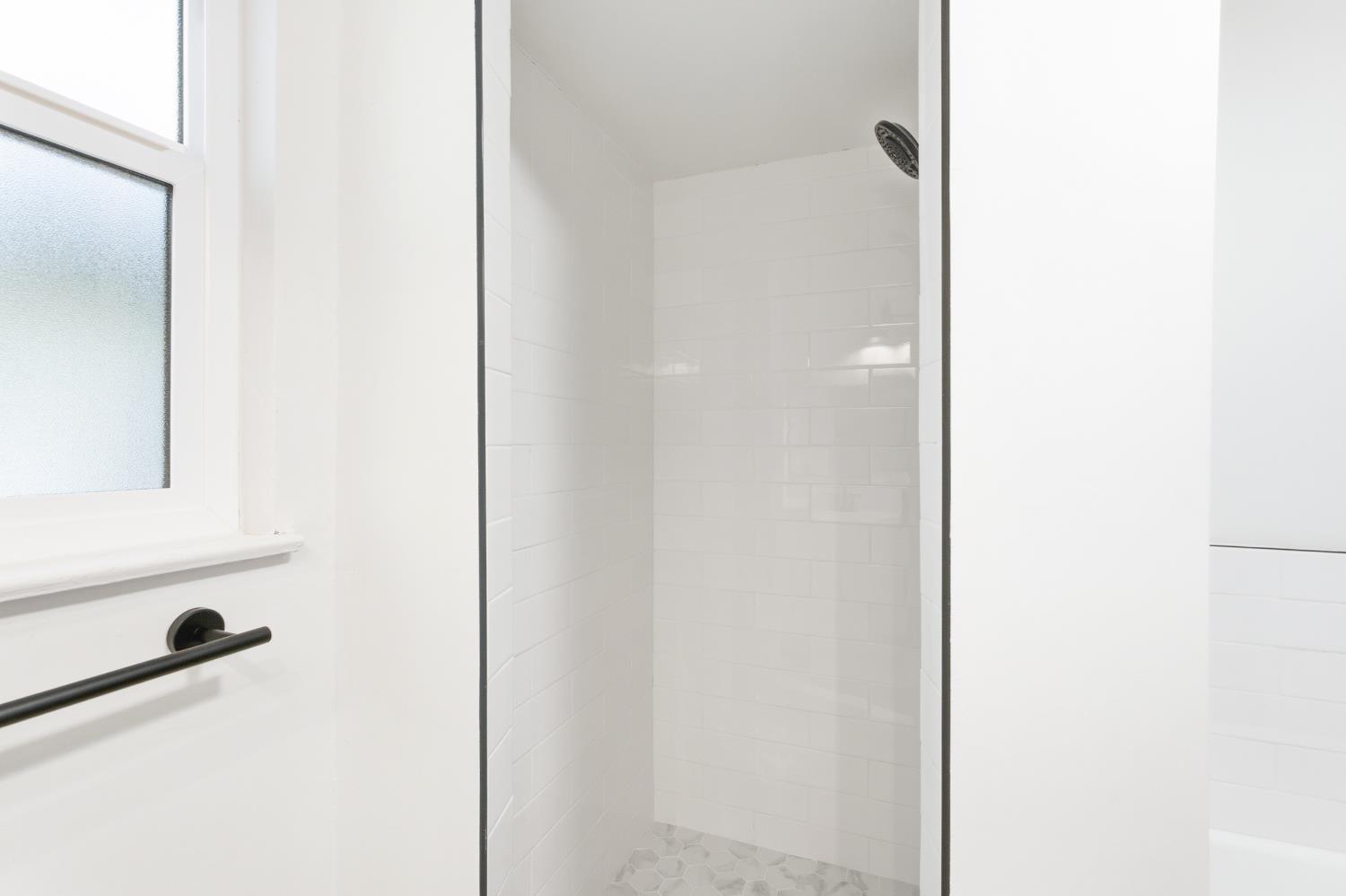 3473 East Dayton Avenue Fresno, CA 93726 - Photo 28 of 49 a bathroom with a shower