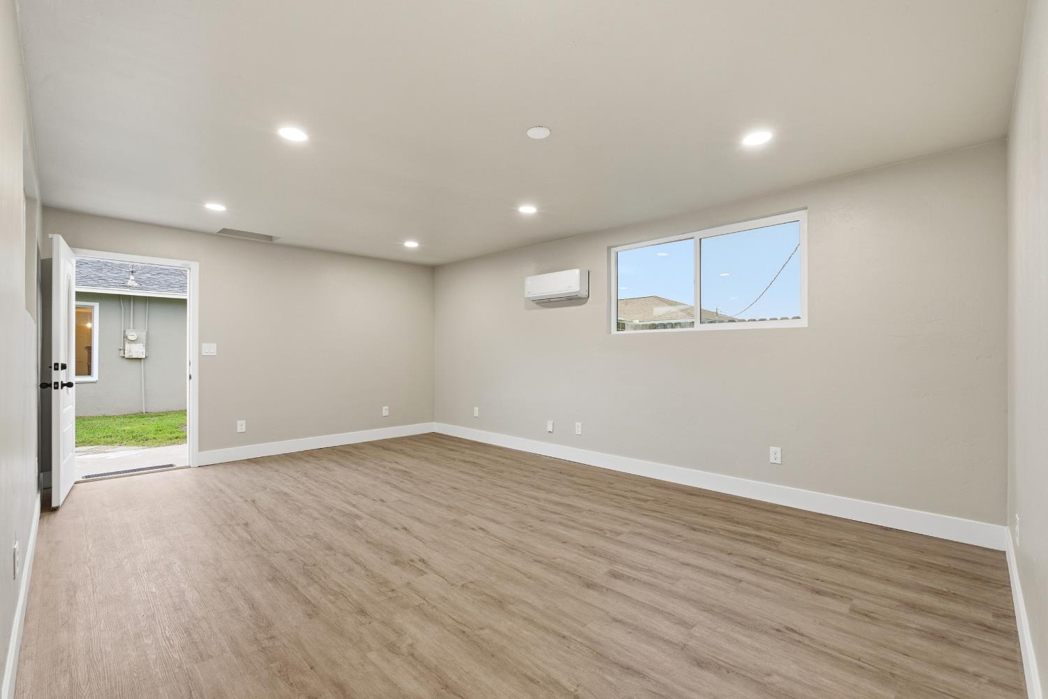 3473 East Dayton Avenue Fresno, CA 93726 - Photo 33 of 49 a view of an empty room with wooden floor