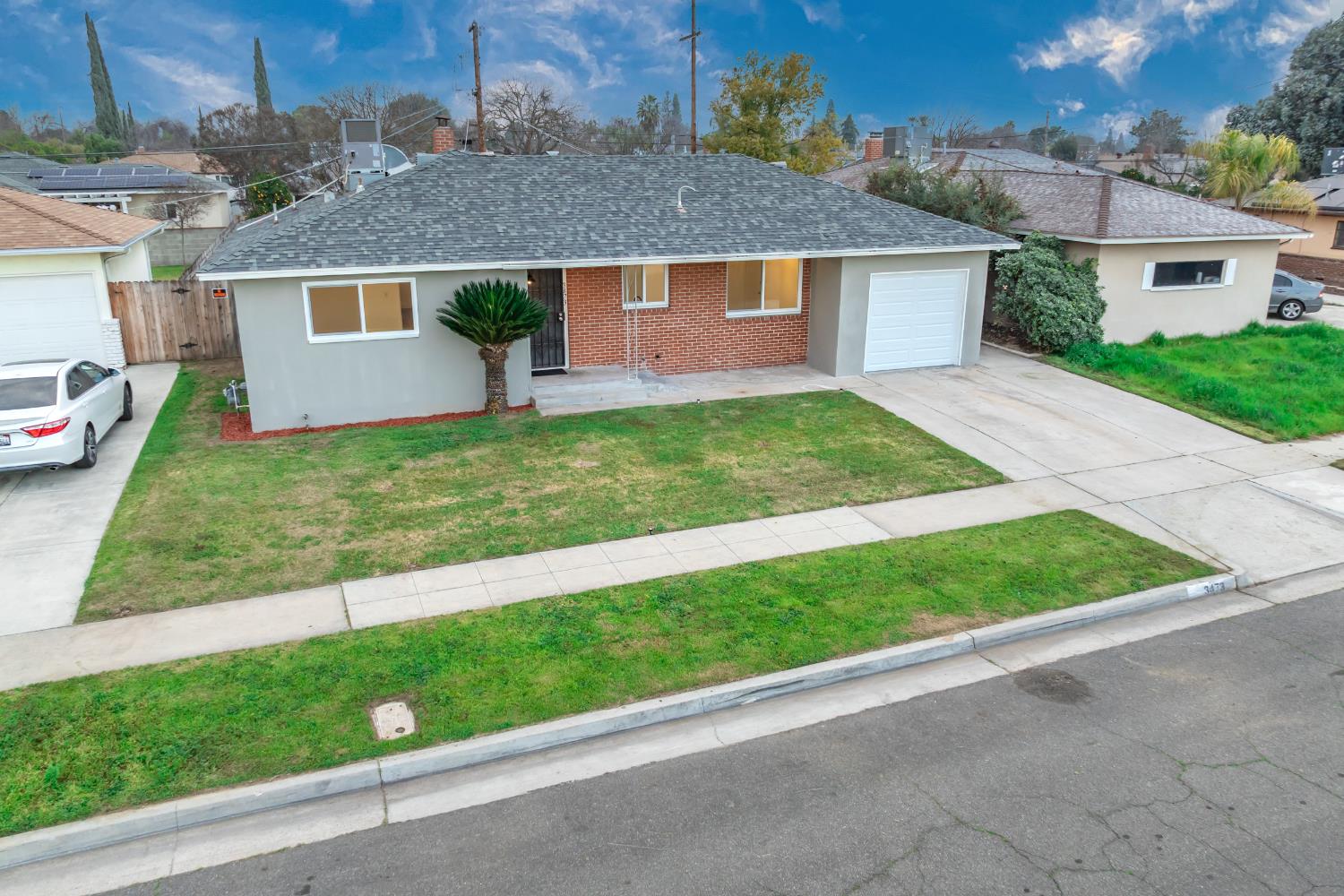 3473 East Dayton Avenue Fresno, CA 93726 - Photo 41 of 49 front view of house with a yard