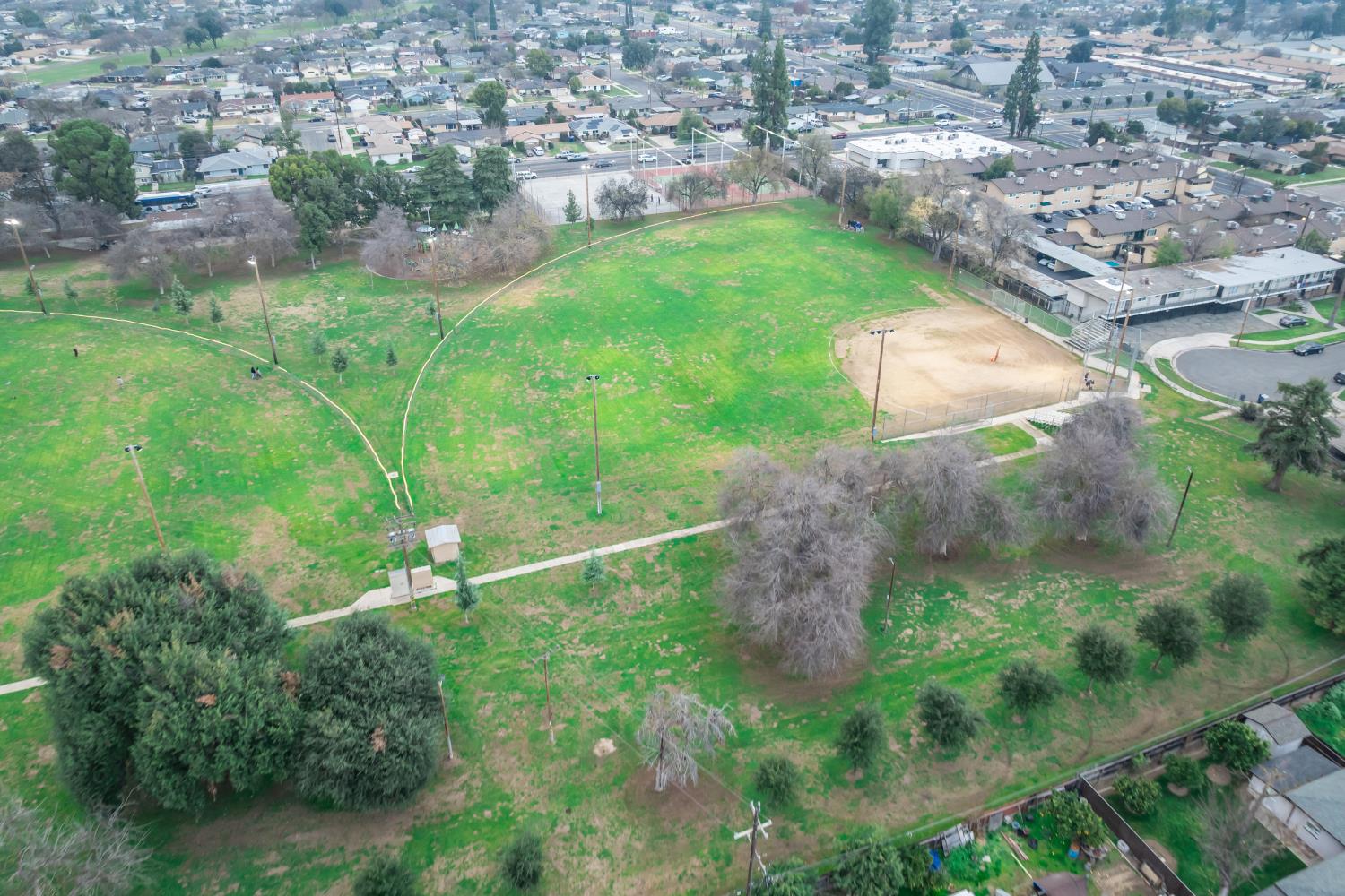 3473 East Dayton Avenue Fresno, CA 93726 - Photo 47 of 49 an aerial view of residential houses with outdoor space and trees