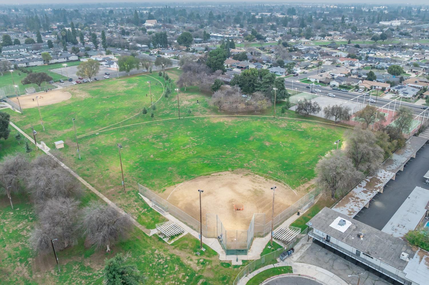 3473 East Dayton Avenue Fresno, CA 93726 - Photo 48 of 49 an aerial view of residential houses with outdoor space and trees