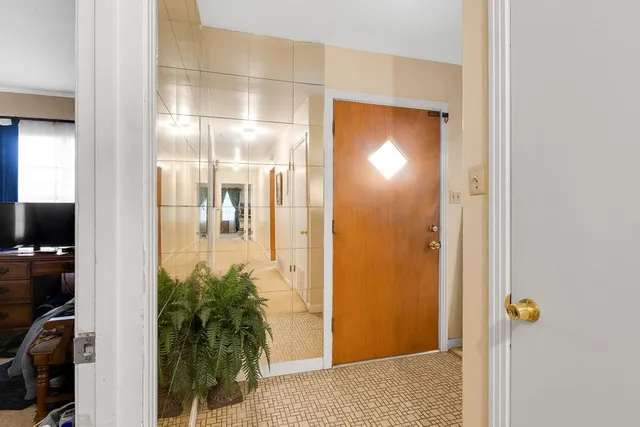 a view of a bathroom from a hallway