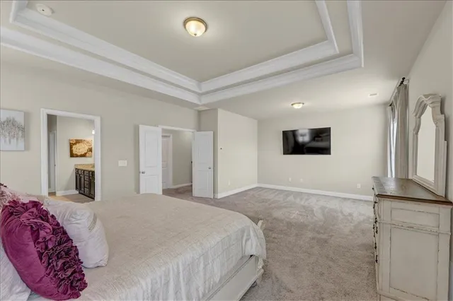 a spacious bathroom with a granite countertop sink mirror and shower