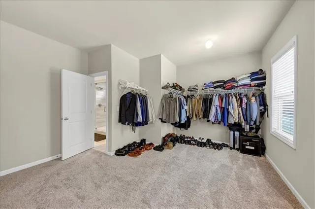 an entryway and livingroom with furniture