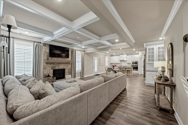a living room with furniture fireplace and flat screen tv