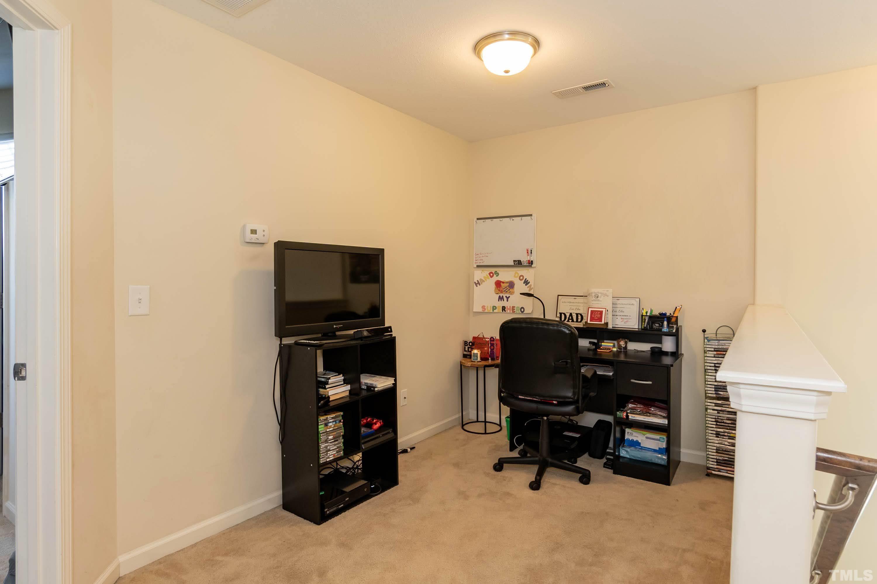 4108 Lady Slipper Lane Durham, NC 27704 - Photo 17 of 33 a room with furniture and natural light