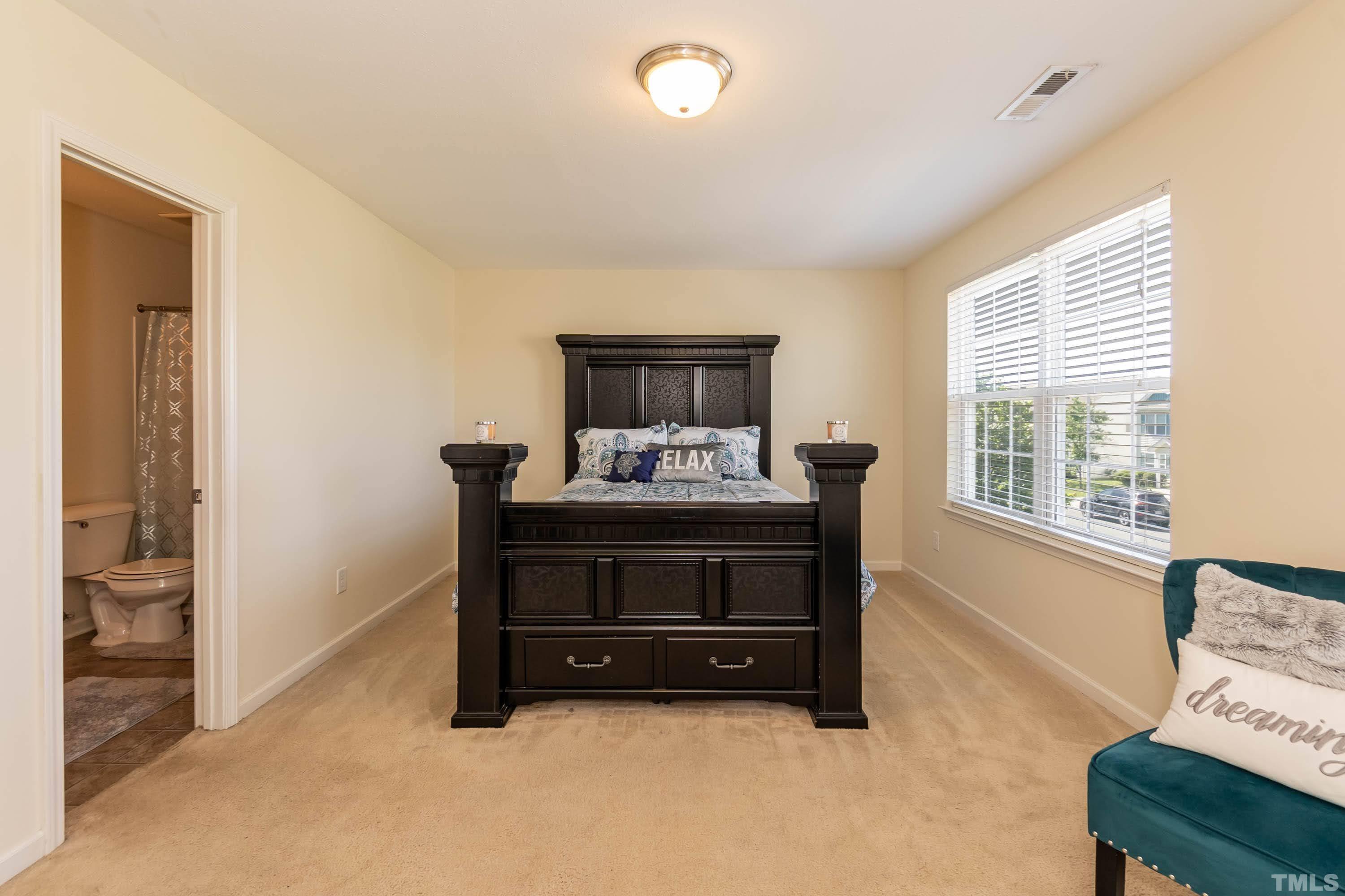 4108 Lady Slipper Lane Durham, NC 27704 - Photo 19 of 33 a living room with furniture and a window