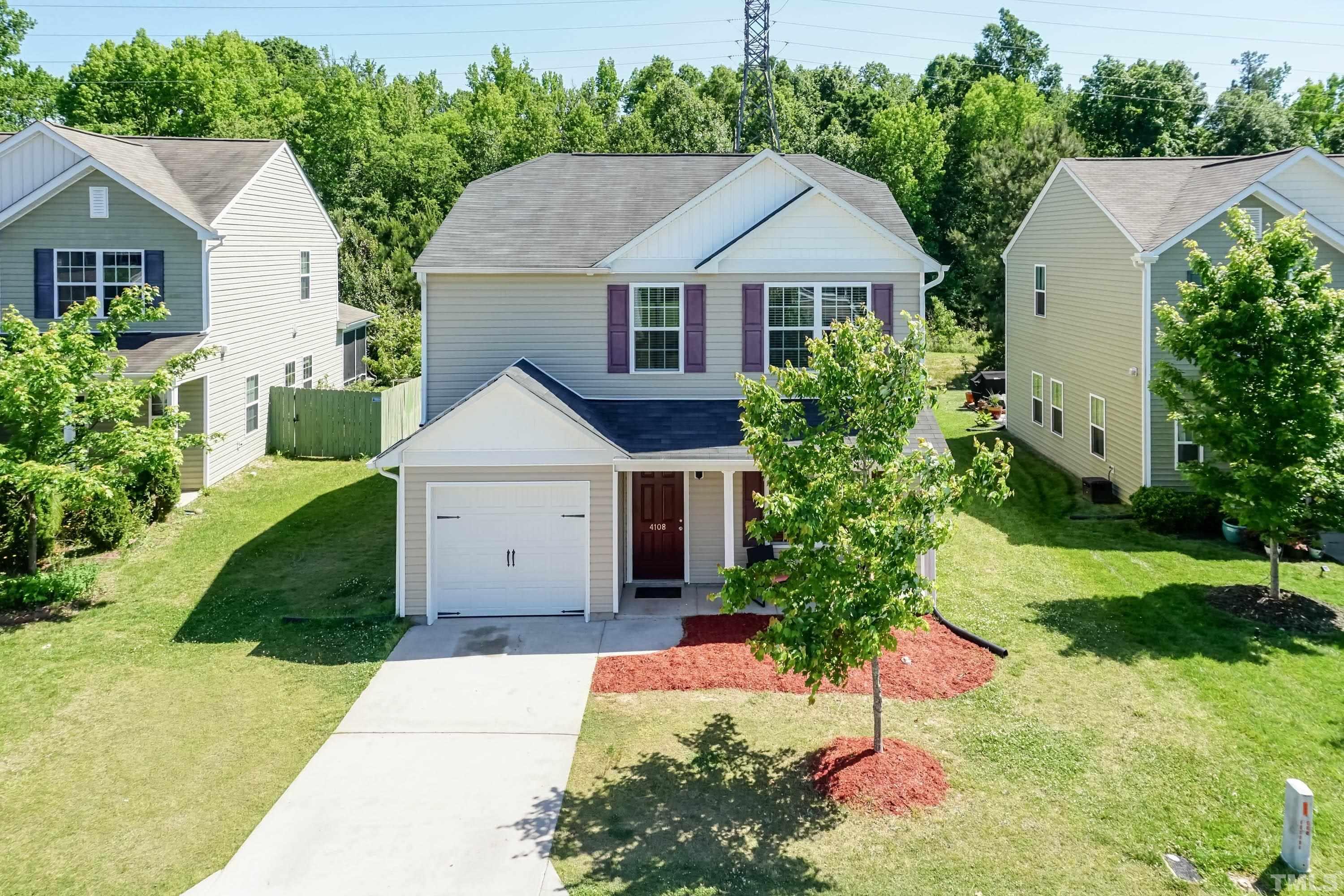 4108 Lady Slipper Lane Durham, NC 27704 - Photo 2 of 33 a front view of house with yard and green space