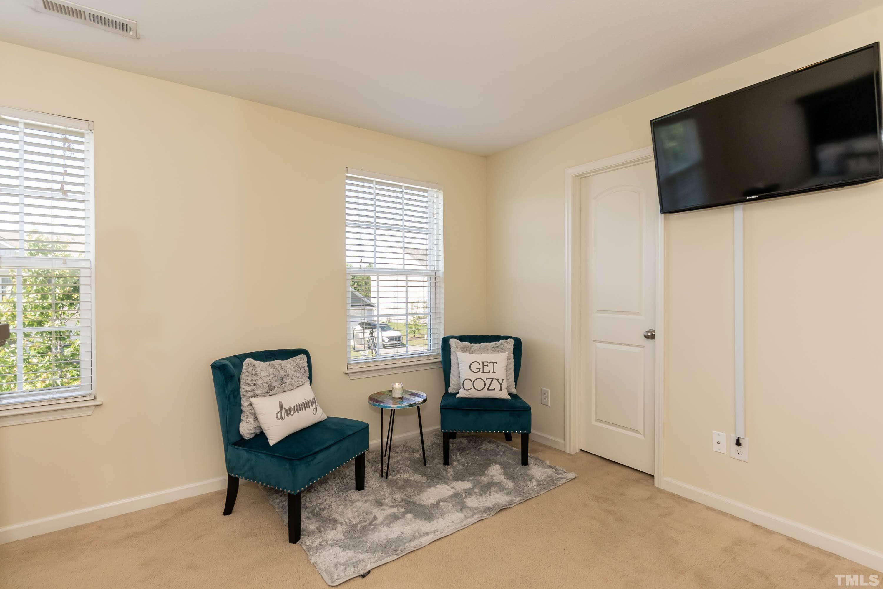 4108 Lady Slipper Lane Durham, NC 27704 - Photo 21 of 33 a living room with furniture and a flat screen tv