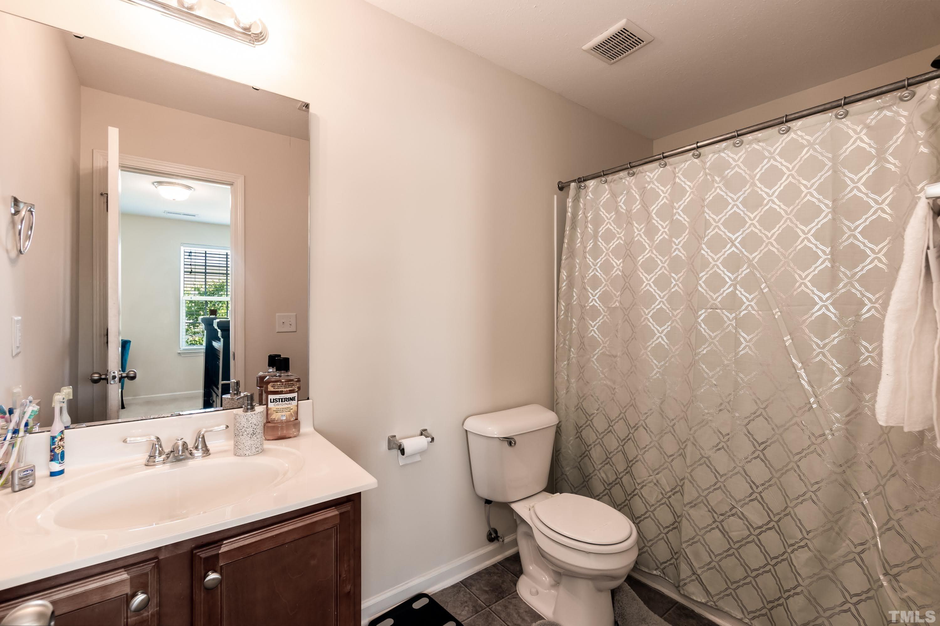 4108 Lady Slipper Lane Durham, NC 27704 - Photo 22 of 33 a bathroom with a sink and a toilet