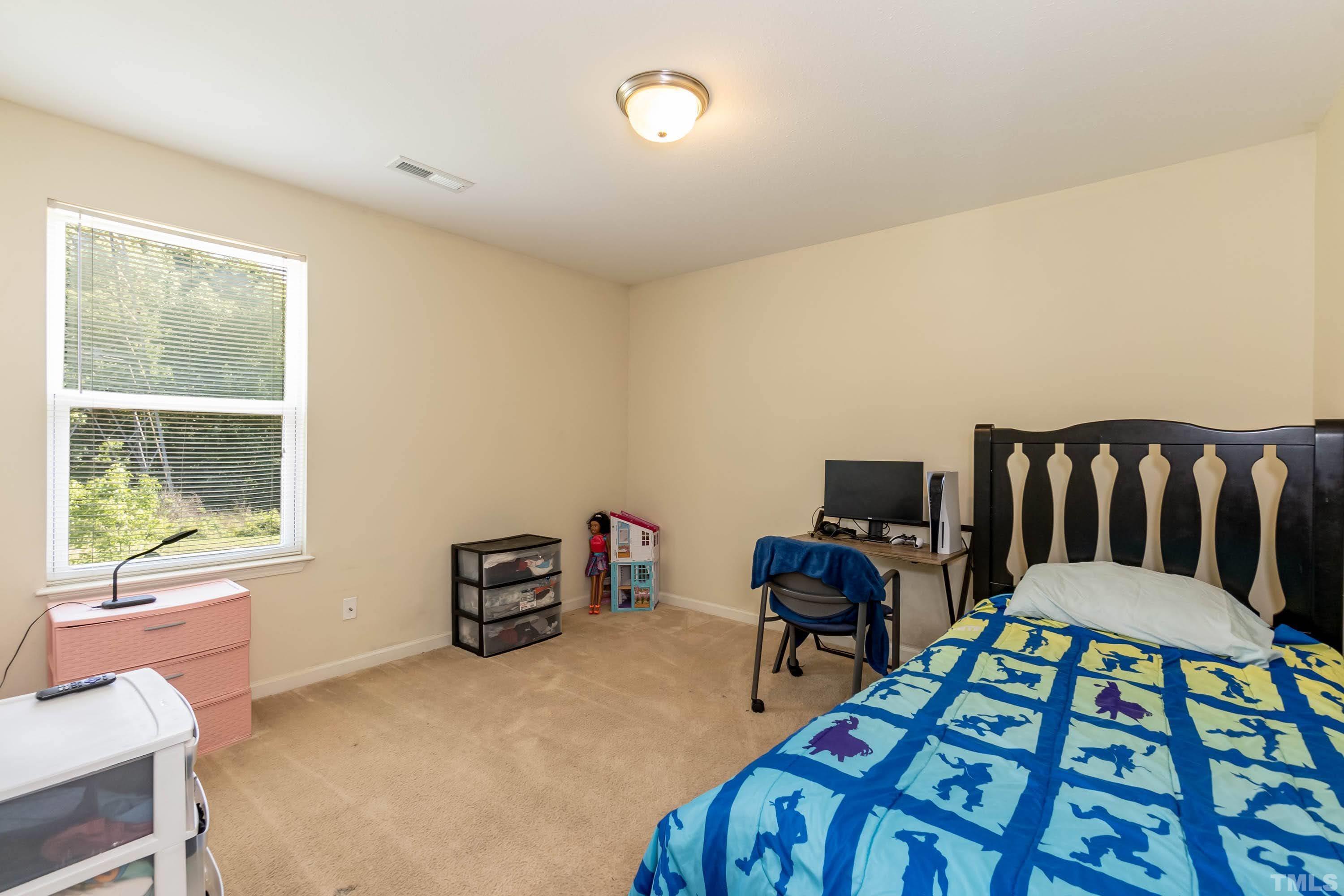 4108 Lady Slipper Lane Durham, NC 27704 - Photo 23 of 33 a workspace with furniture and a window