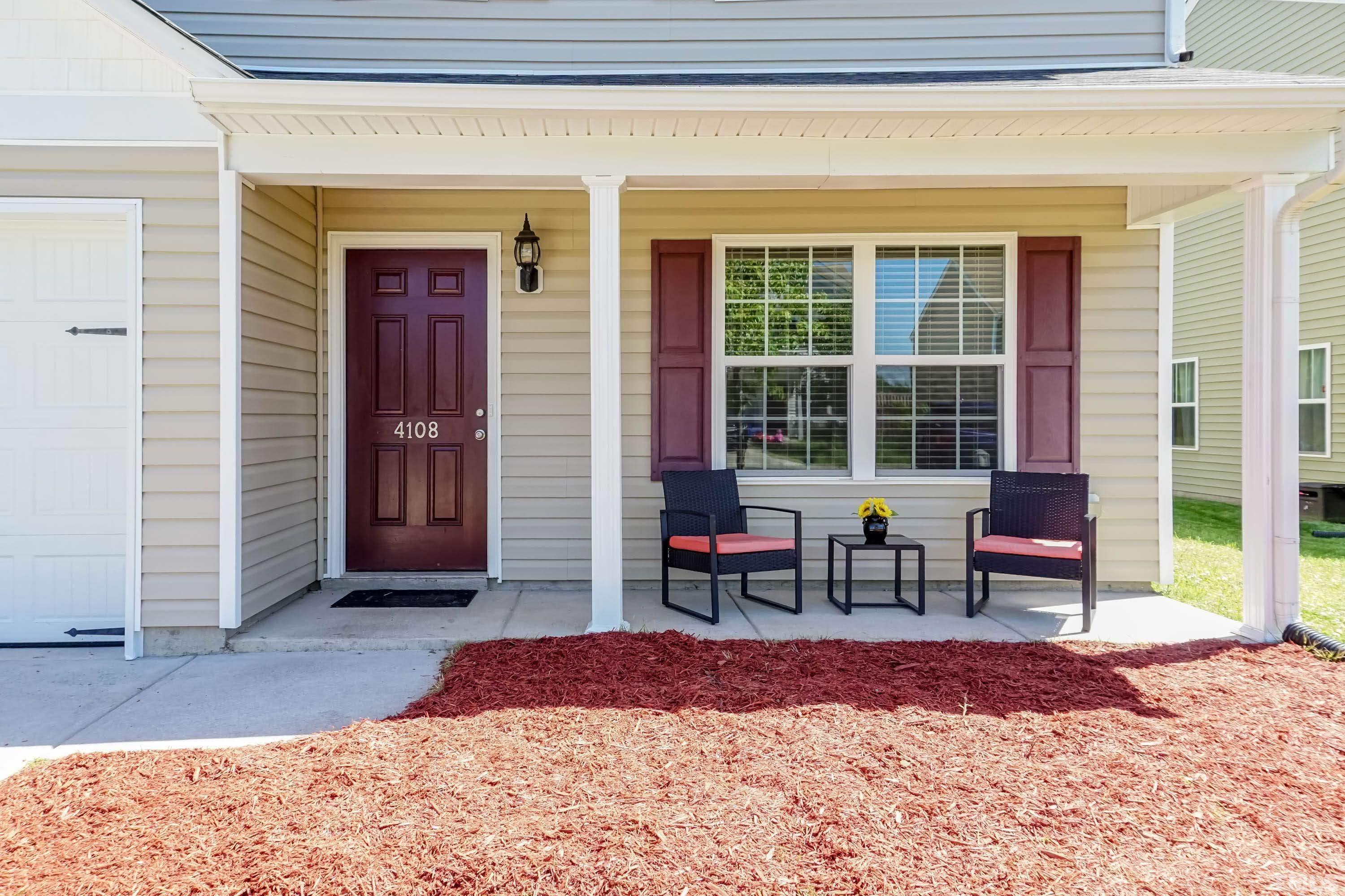 4108 Lady Slipper Lane Durham, NC 27704 - Photo 32 of 33 a front view of a house with outdoor seating