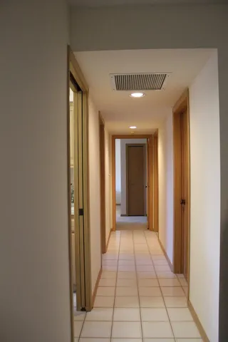 a bedroom with a bed and a desk