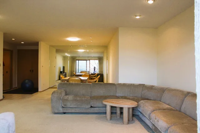 a living room with furniture and a couch