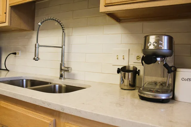 a kitchen with a sink and a stove