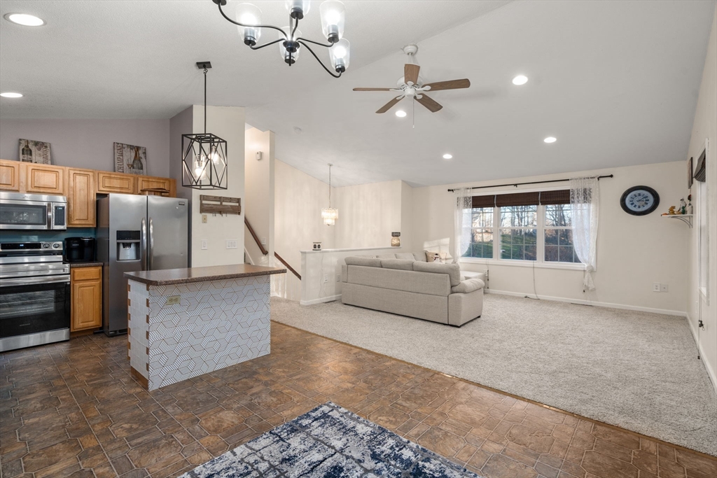 89 Jarvis Avenue Holyoke, MA 01040 - Photo 11 of 27 a living room with furniture and kitchen view