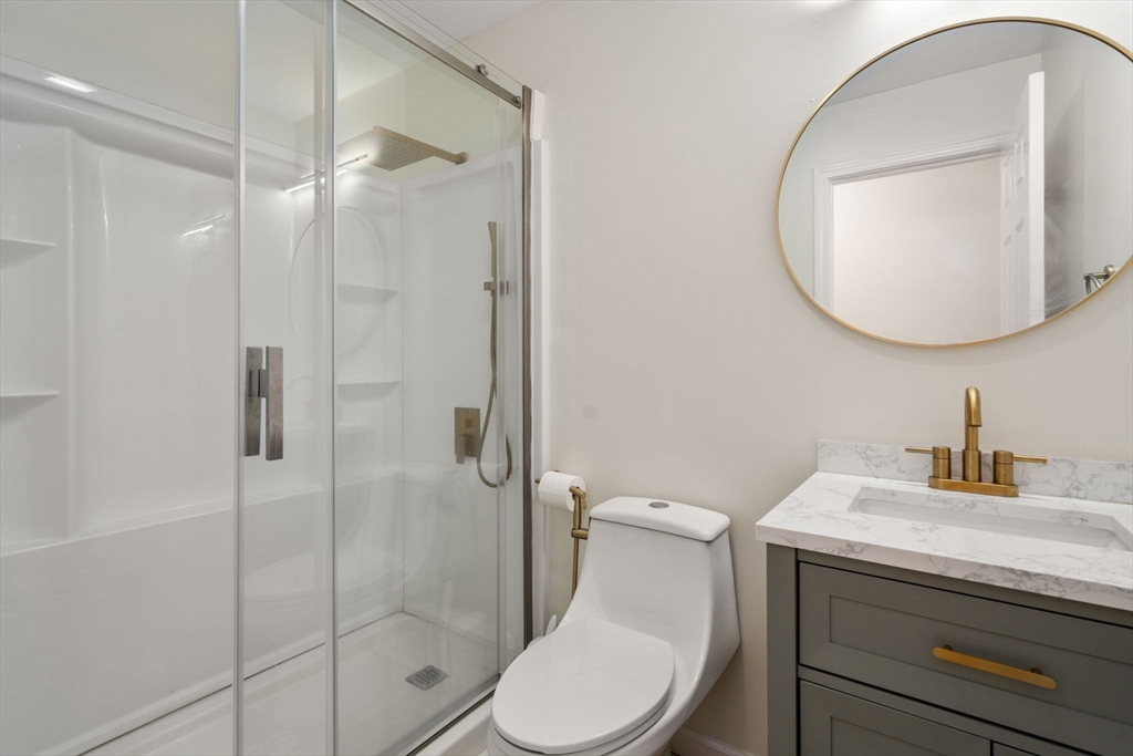 89 Jarvis Avenue Holyoke, MA 01040 - Photo 22 of 27 a bathroom with a toilet a sink and shower